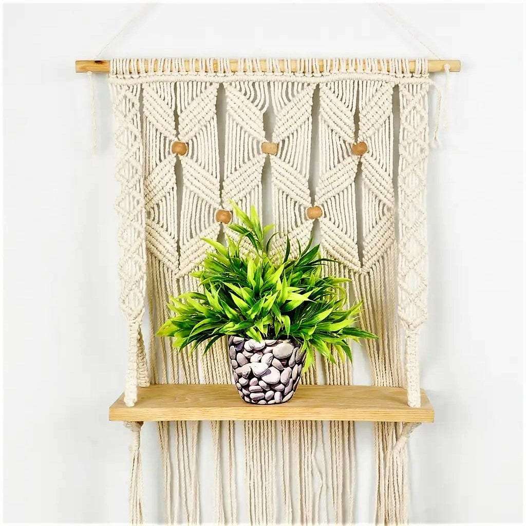 Macrame wall hanging shelf with leaf pattern Writings On The Wall Wall Hanging