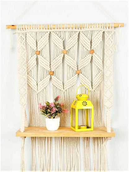 Macrame wall hanging shelf with leaf pattern Writings On The Wall Wall Hanging