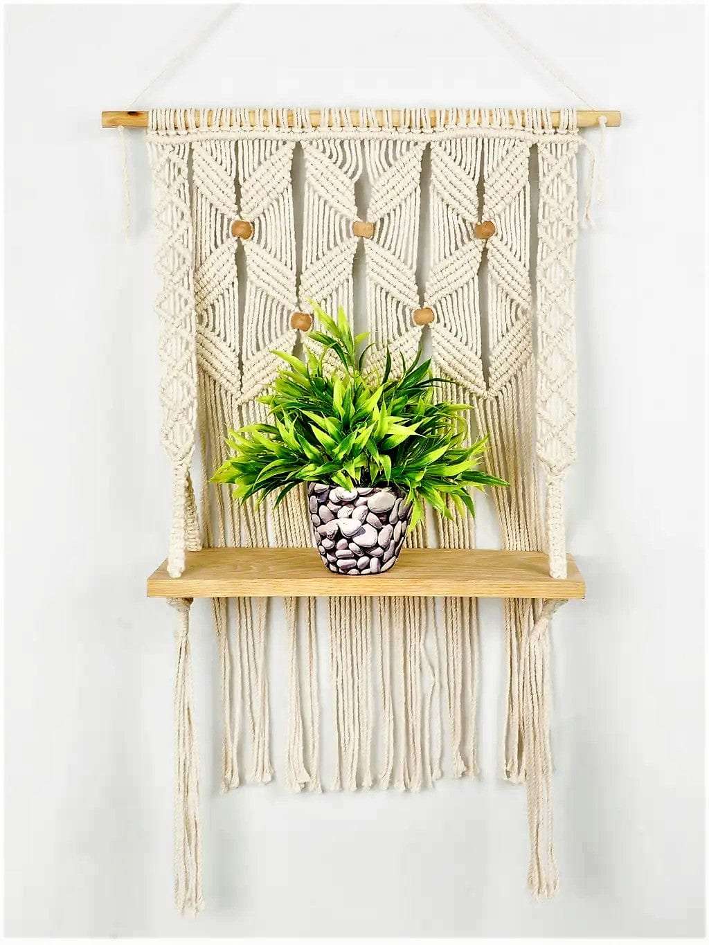 Macrame wall hanging shelf with leaf pattern Writings On The Wall Wall Hanging