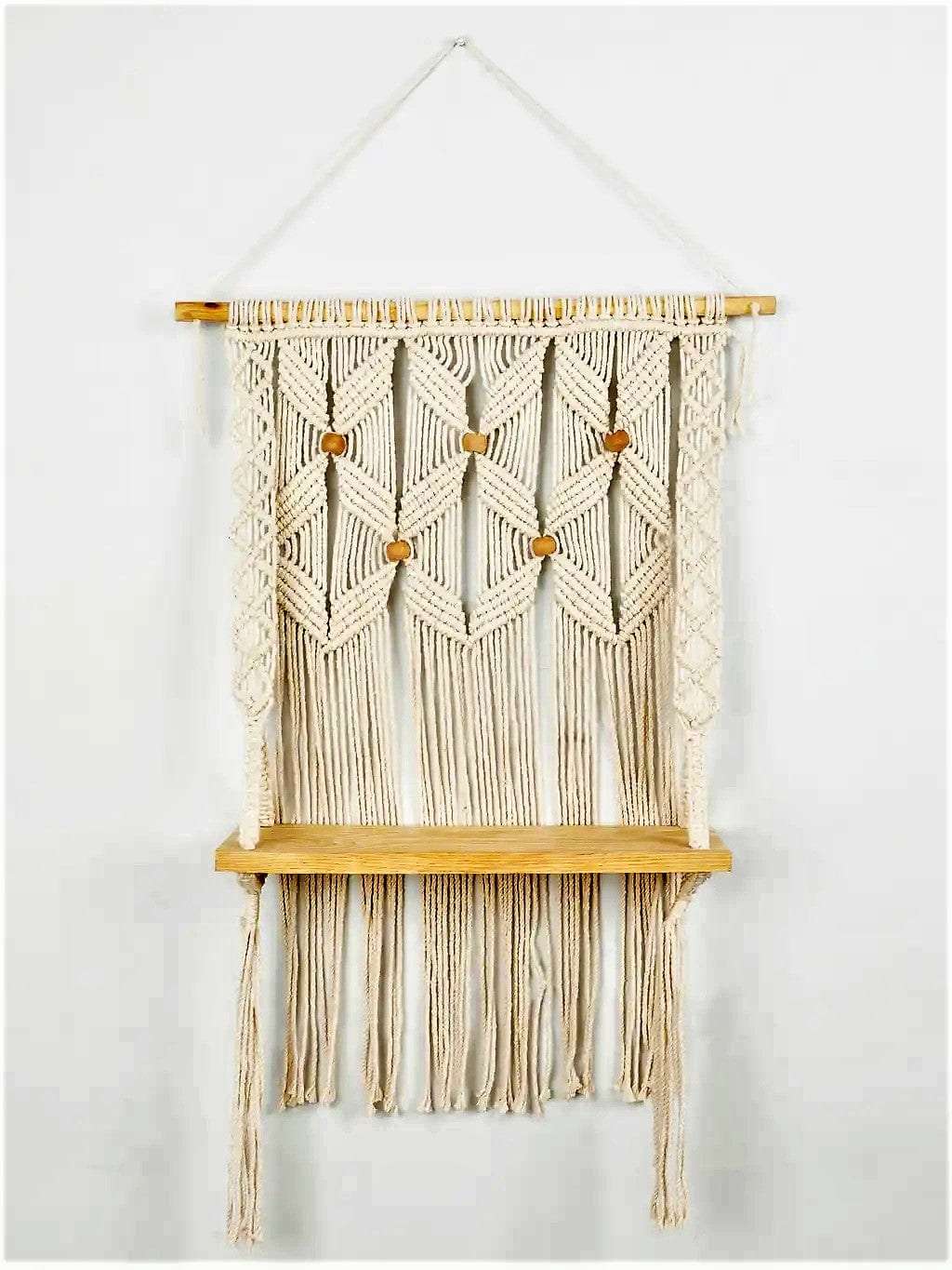 Macrame wall hanging shelf with leaf pattern Writings On The Wall Wall Hanging