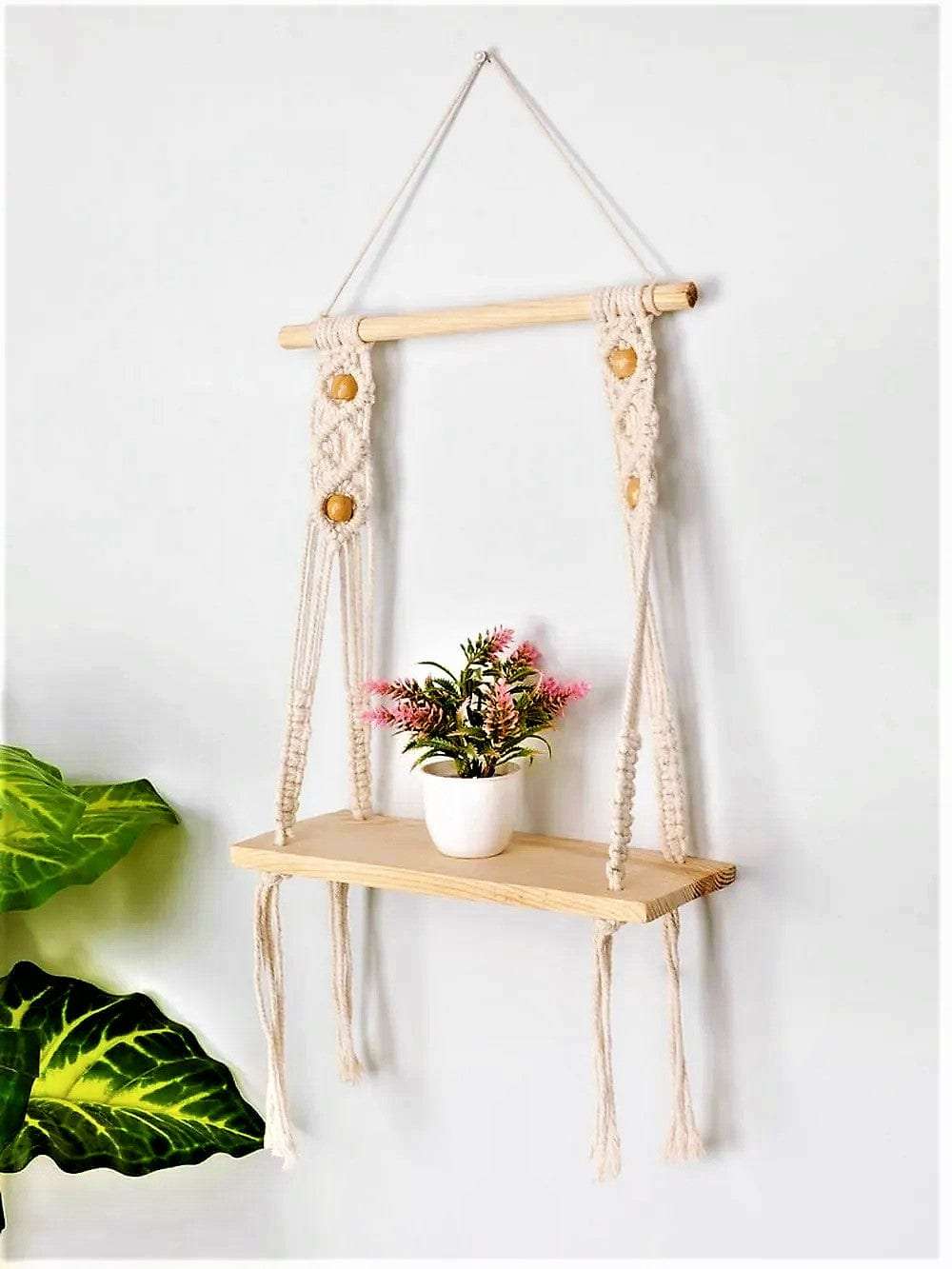Macrame wall hanging shelf with open back chain pattern Writings On The Wall Wall Hanging