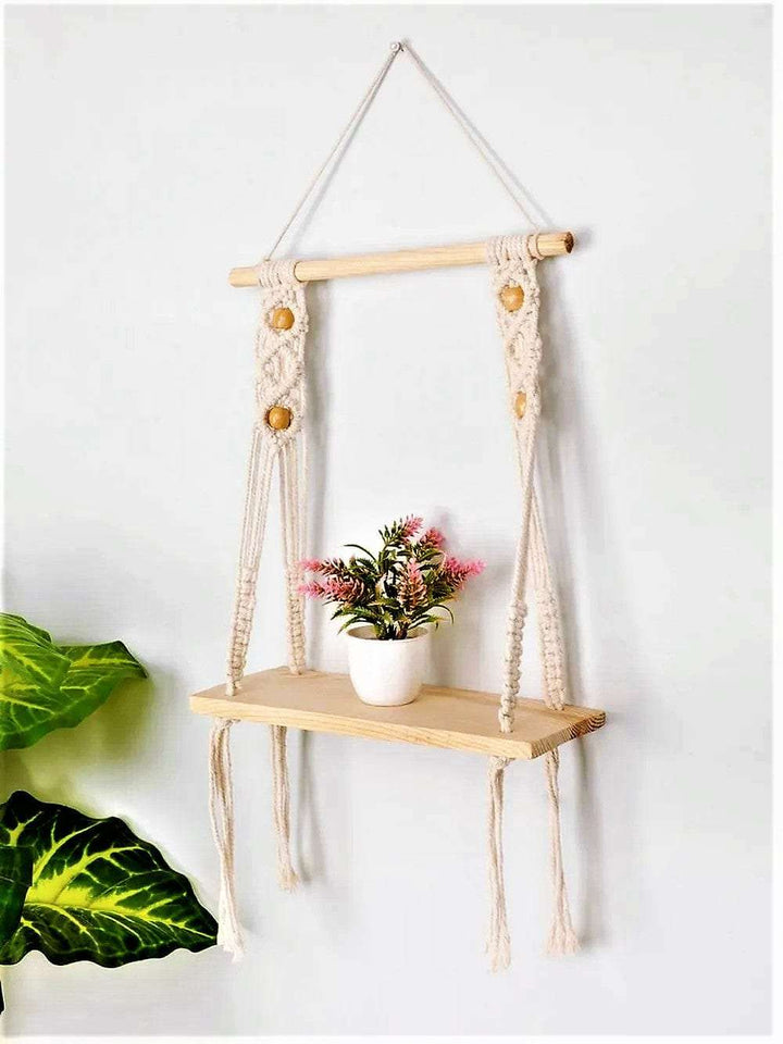 Macrame wall hanging shelf with open back chain pattern Writings On The Wall Wall Hanging