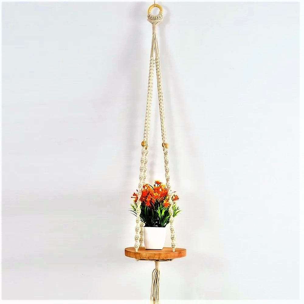 Macrame wall hanging with round shelf Writings On The Wall Wall Hanging