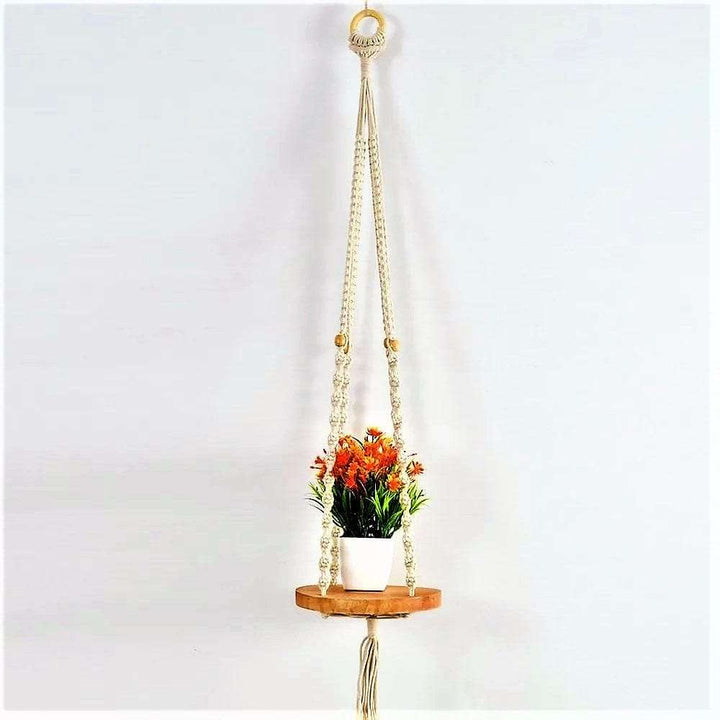 Macrame wall hanging with round shelf Writings On The Wall Wall Hanging