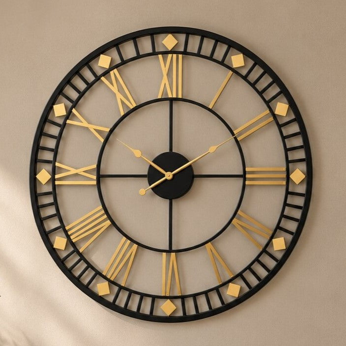 Black and gold Roman numeral designer wall clock, front view
