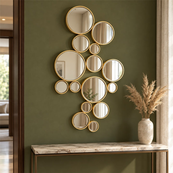 Golden round cluster wall mirror in a foyer