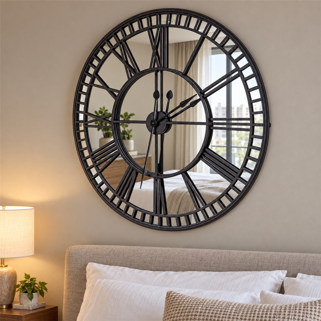 Mirror wall clock above a bed in a bedroom