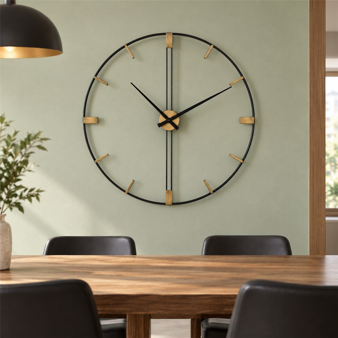 Sleek black and gold metal wall clock above a dining table