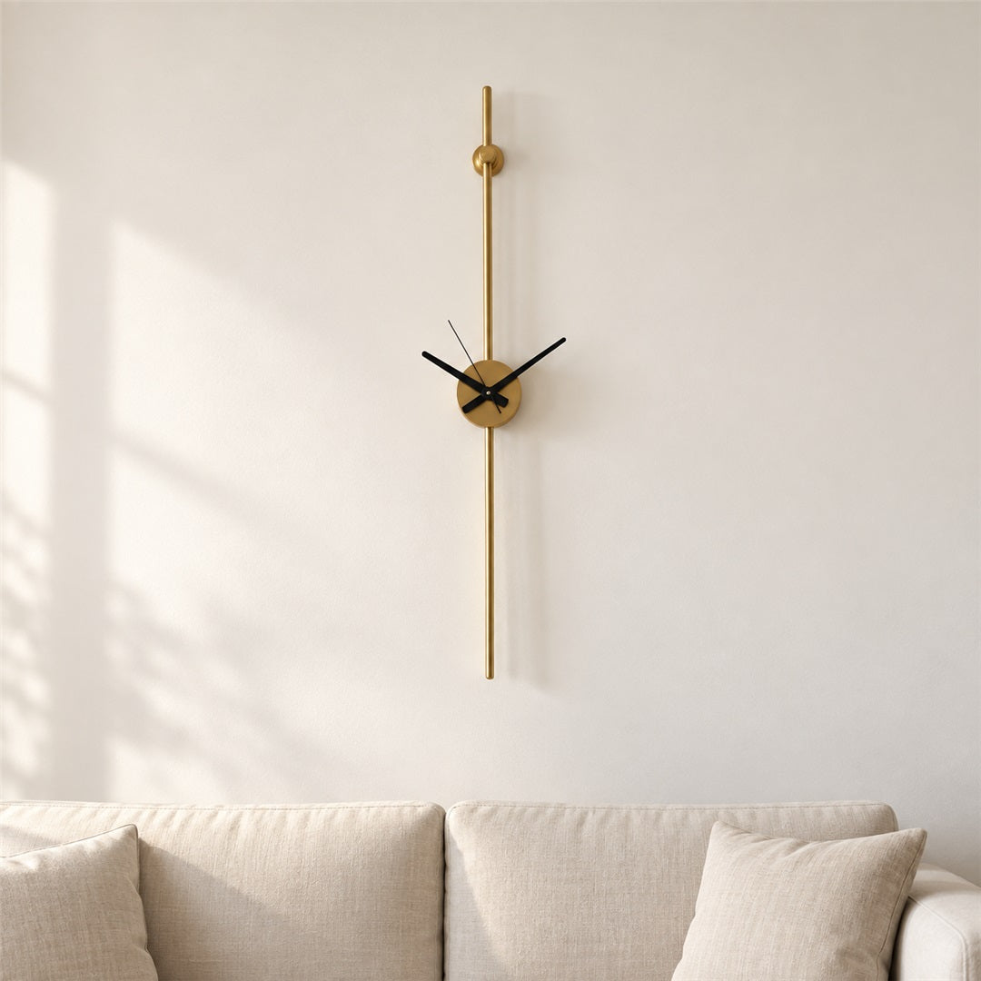 Minimal slim gold wall clock on a living room wall